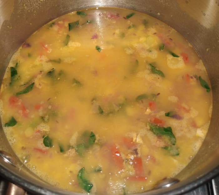Add water to achieve the desired consistency and cook the dal over low flame. (If you want thick dal then add less water.)