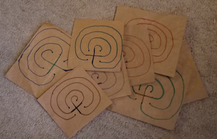 Make a bunch of finger labyrinths to walk and write on from journal prompts, then bind all of the ones you created for one project together as a record of your creative process for that project. They can serve as companions to your writing journal.