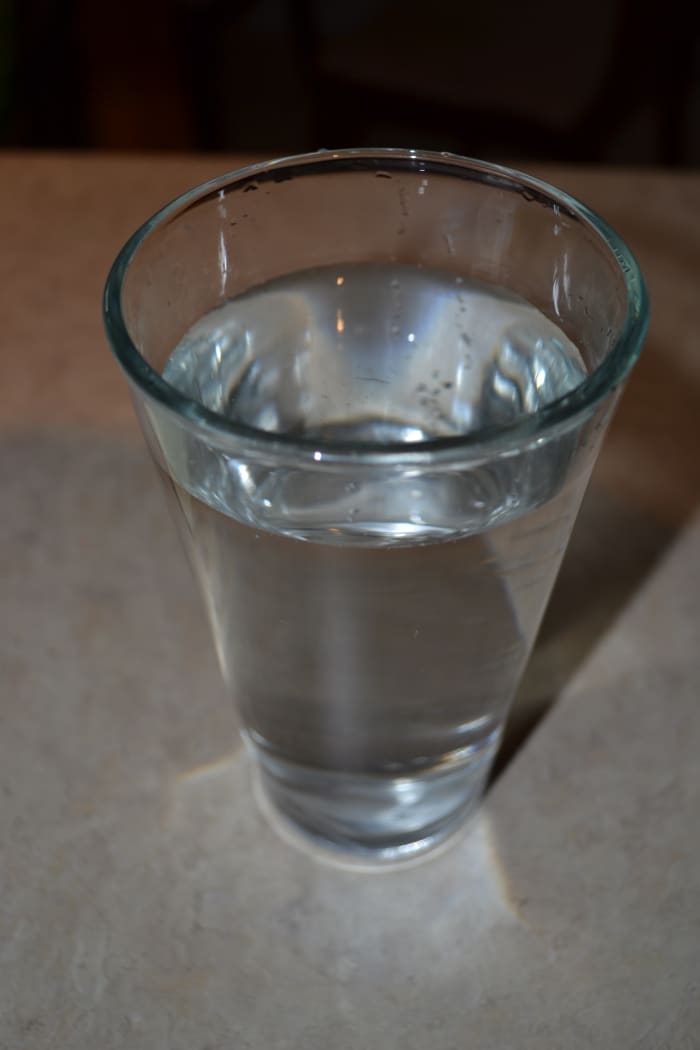 One teaspoon of aluminum free baking soda in a gallon of water will create an alkaline level.