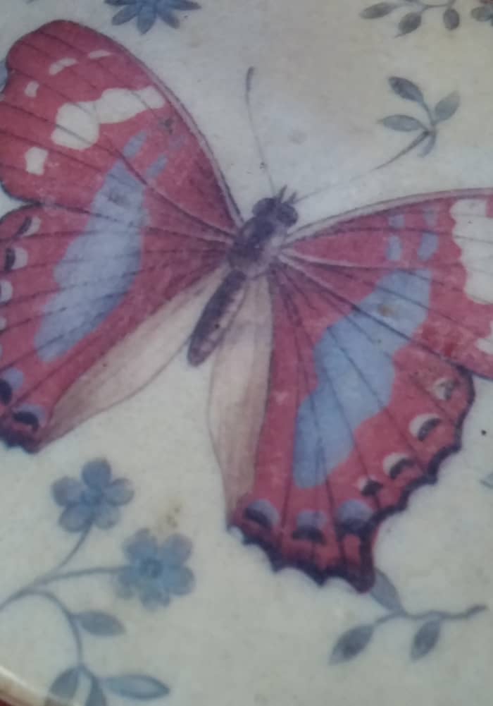 I purchased a set of beautiful butterfly coasters at the dollar store. Wrap them in colored cellophane and add a bow.
