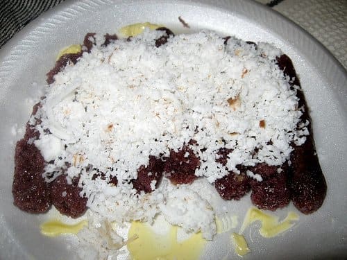 Puto Bumbong Served with Freshly Grated Coconut and Butter (Photo courtesy by arnold - inuyaki from Flickr.com)