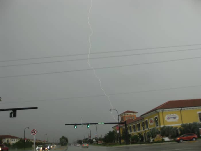 I took this picture during the storm I describe here - no, not while driving; I was at a red light! The picture really doesn't do it justice at all...but I was proud of myself for actually catching one with the camera!