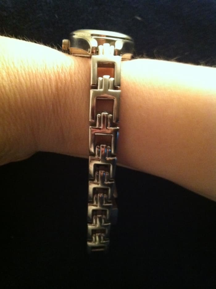 Figure 1. The Bracelet is Laying Loosely Around Your Wrist, Pressed Up Against a Soft Surface Such as Furniture