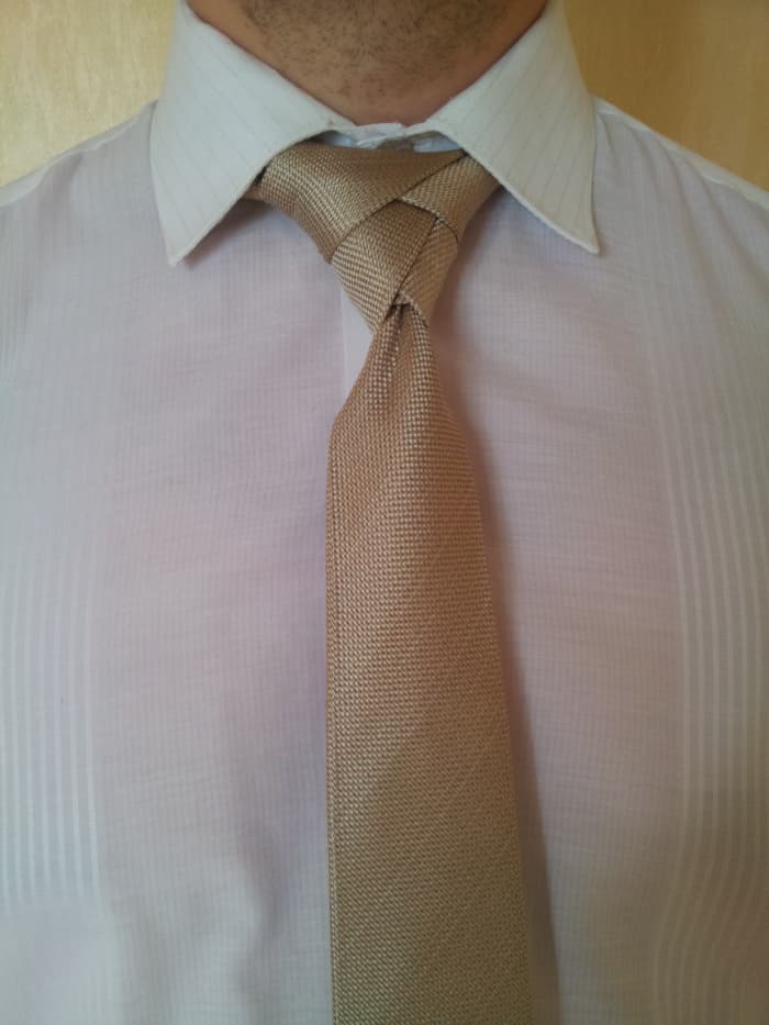 Step 15. The task is almost complete now. Just lower the corners of your collar, arrange the knot properly to fit the collar spread and voila! You've done that!