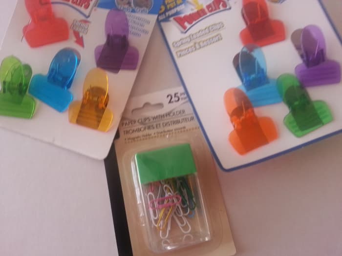 Colorful clips, paperclips purchased at the local dollar store for $1 each. I really love the tiny brightly colored clothes pins, but they did not have any I could find at the time.