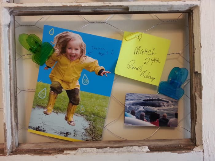 A closer look at this section of the message / picture board contains a sweet birthday card from my brother, who reminded me of when we were very small and used to where those yellow raincoats. Also, another trip with my mother to see blue whales.