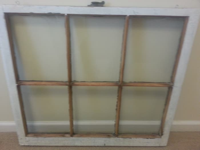 Old wood window after stripping off the painted flowers and back down to the plain glass, before repurposing it to my taste.