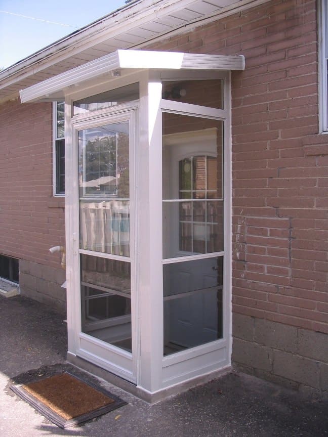 Incorporating a vestibule, like seen on this house, in your cat-shelter design will help prevent cold air from reaching the cat as it beds down for the night.