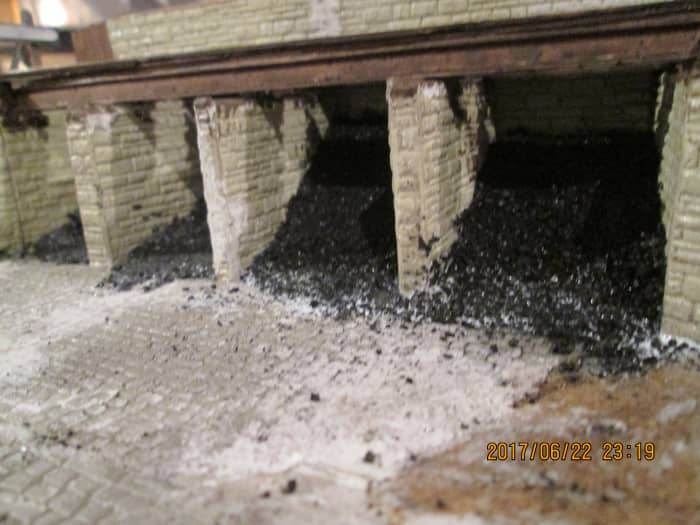 The plastic slopes have been covered with real coal - still some left after all this time, from the lump I took from a small pile at North Woolwich Station (down the road from Silvertown and the Thames Barrier). All that needs adding is the hand rail
