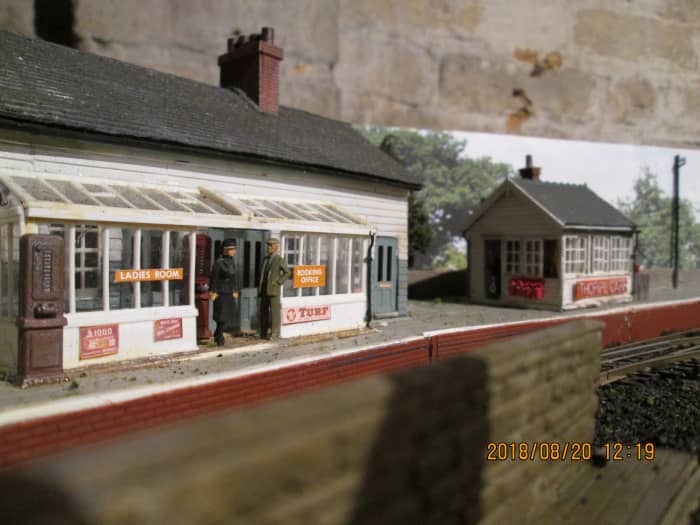 Station offices and waiting room with reinstated signal cabin. In the foreground is the coal depot wall to stop coal dust being blown onto passengers - a consideration witnessed across the region where coal depots were close to passenger facilities