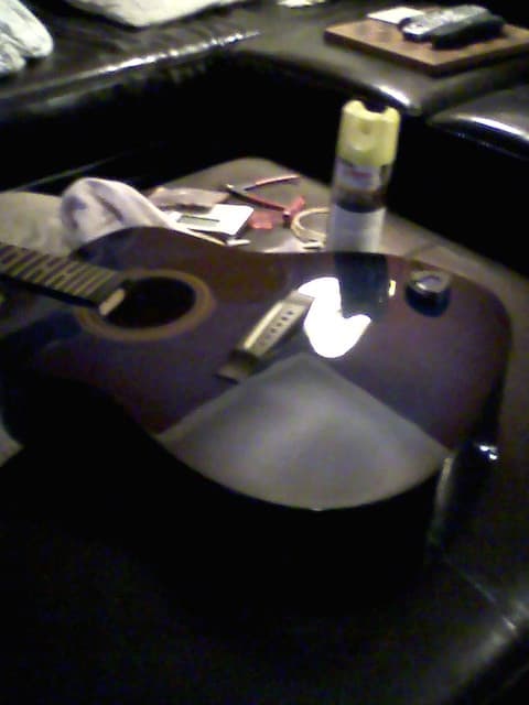 Having all strings off is a great opportunity to clean the fretboard and polish the top, as has been done here.