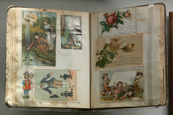 A vintage scrapbook from the late 19th / early 20th century, currently held in the Women's Museum in Dallas, Texas.