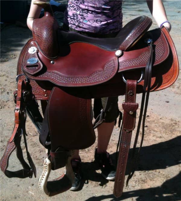 With all of these straps and stirrups dangling, I'm certain to trip on one walking this saddle to the horse.