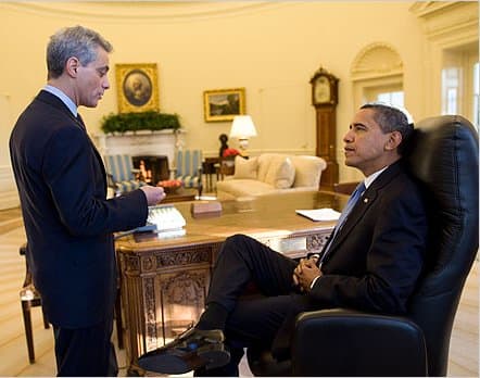 Notice Obama's calm and relaxed posture. As he leans back in his chair, his body language shows that he is in control.