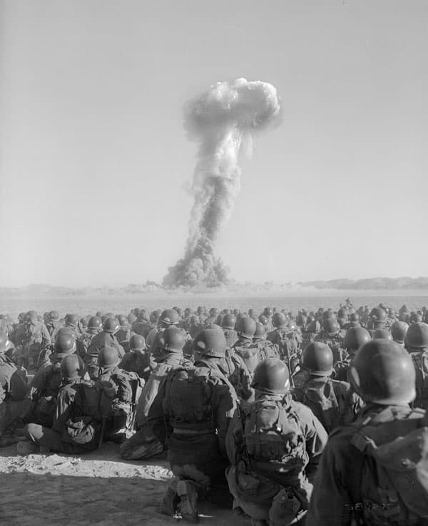 Troops of the Battalion Combat Team, U.S. Army 11th Airborne Division, watch a nuclear blast on Yucca Flats as part of the exercise "Desert Rock I," November 1, 1951.