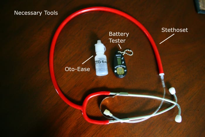 A stethoset, battery tester, and some lubricant (like Oto-Ease) are helpful tools when putting in a child's hearing aids.