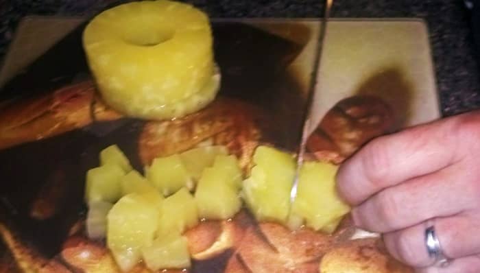 Chop the pineapple if you are unable to purchase it cubed or crushed in heavy syrup. Personally, I prefer to chop the pineapple myself so I can make the perfect sized chunks that my family enjoys.
