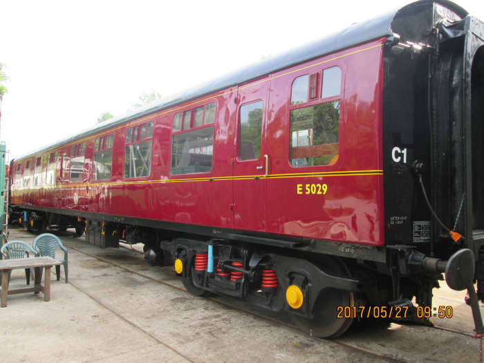 Beautifully restored 2nd generation British Railways open carriage with Commonwealth bogies, Timken roller bearings. Vehicle was privately bought, probably brought on a low-loader, liveried 'chocolate and cream' (Western Region) now with 'E' prefix