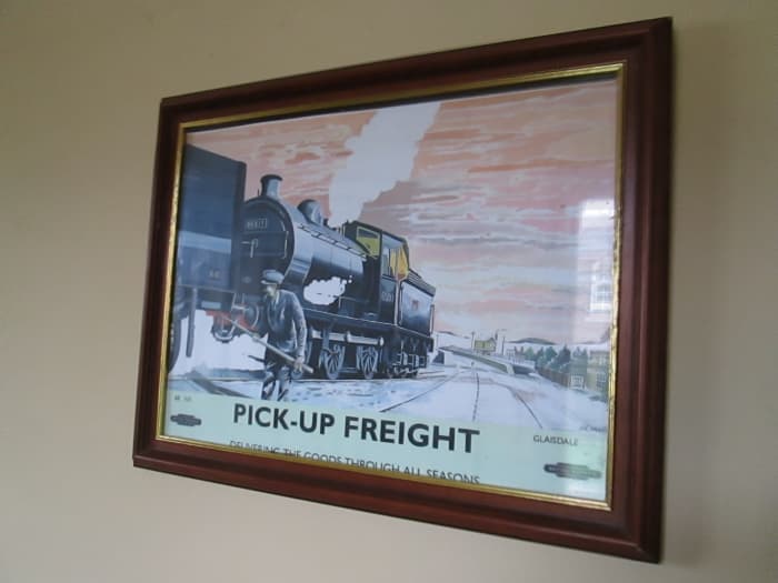 Framed and glazed public information poster shows daily pick-up goods service provided by the railway company (the caption just tells you the scene is Glaisdale on the Whitby-Middlesbrough route)