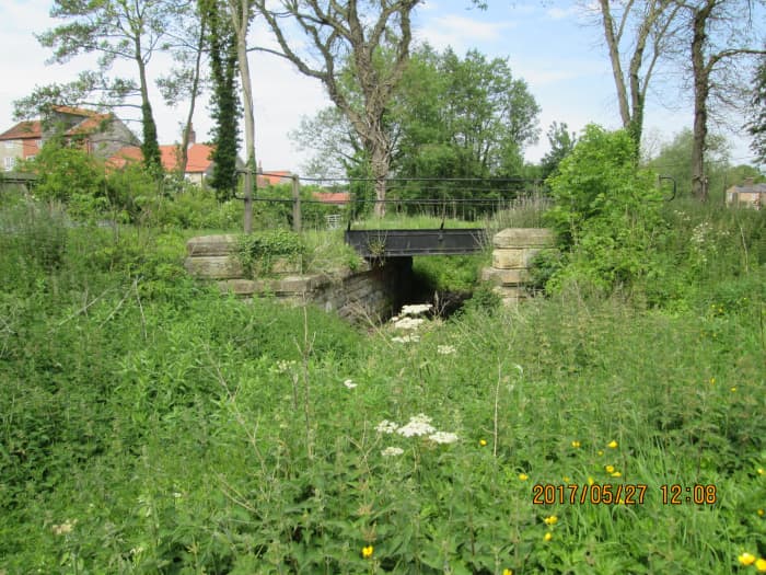 Another of the three cast-iron bridges, both now being on privately owned land. This one crosses a stone-built storm drain to a public footpath