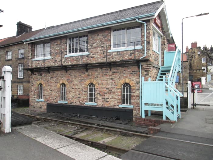 Using recycled bricks from Whitby Town's three-storey signal cabin, Grosmont's 1990 built brick signal cabin controls the crossing gates as well the NYMR signals to the new gantry on the Whitby end of the station