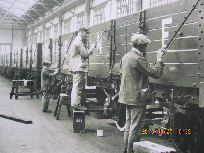 Wagons completed and painted, the time came for lettering & numbering. One man paints the 'N' in the left panel, his workmate adds the 'E'. 'NE' was the cypher for North Eastern and London & North Eastern Railway revenue earning wagons and vans