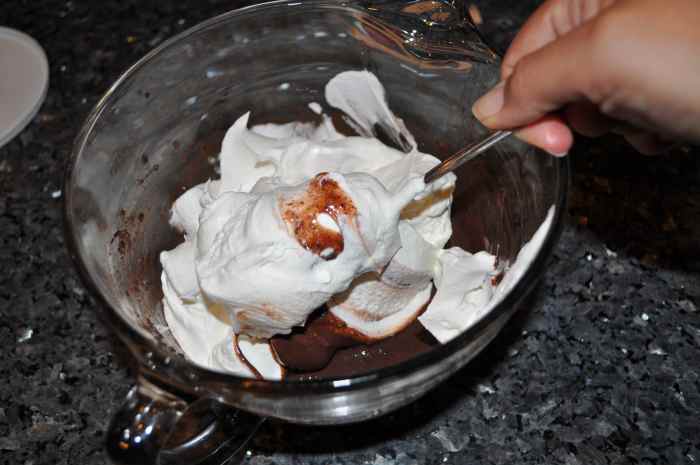 Whip in the cool whip. Make sure to get all parts of the pudding otherwise some parts will be stronger than others, but don't over mix.