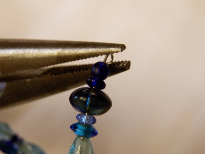 Use pliers to bend the wire backwards at both ends so beads don't come off the bracelet.