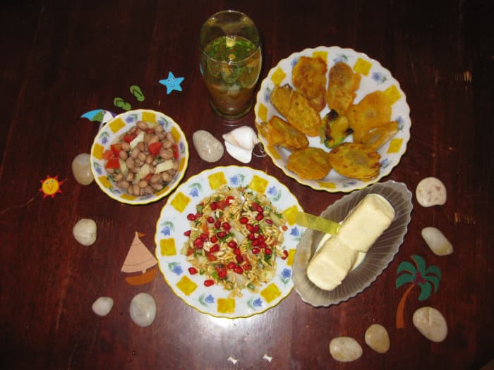 5 homemade Indian snacks - cumin beverage, boiled peanuts salad, vegetable fritters, puffed rice snack and frozen milk dessert
