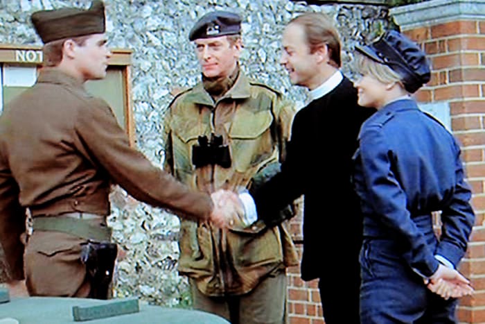 Four people getting on well together - but one is an imposter. Treat Williams as the American Captain, Michael Caine as Colonel Steiner (alias 'Colonel Miller'), John Standing as Father Verecker, and Judy Geeson as Pamela