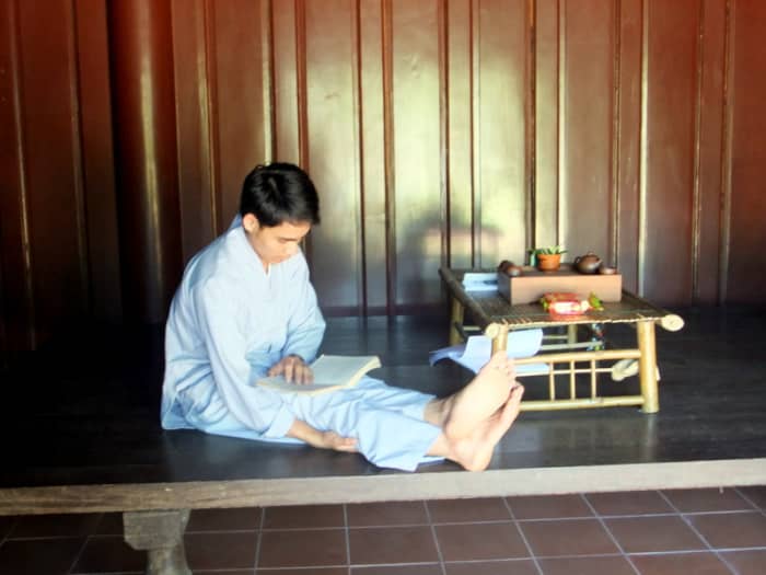 Student monk studying in one of the building which I suspect is also his lodging area, at Thien Mu pagoda