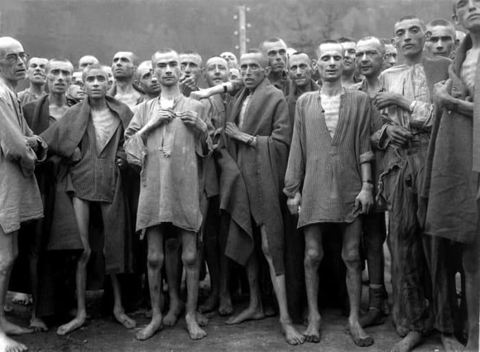This harrowing photo shows starving prisoners at the Nazi run Mauthausen concentration camp in 1945.