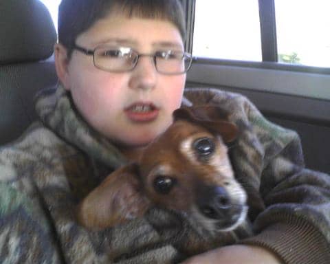 Look at this handsome young man who lives a pretty normal life. He is 14 years old with Daphne our little dog who has since on Dec 25, 2012 past away.