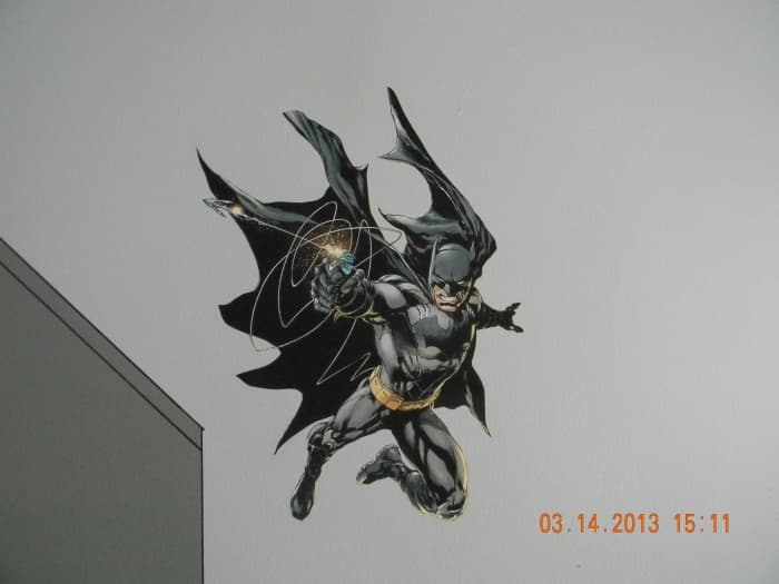 Here you can see 1 of the 2 Batman pieces that was printed on indoor polypropylene and attached with DIF wallcovering adhesive. This one is swinging down on the Gotham skyline.