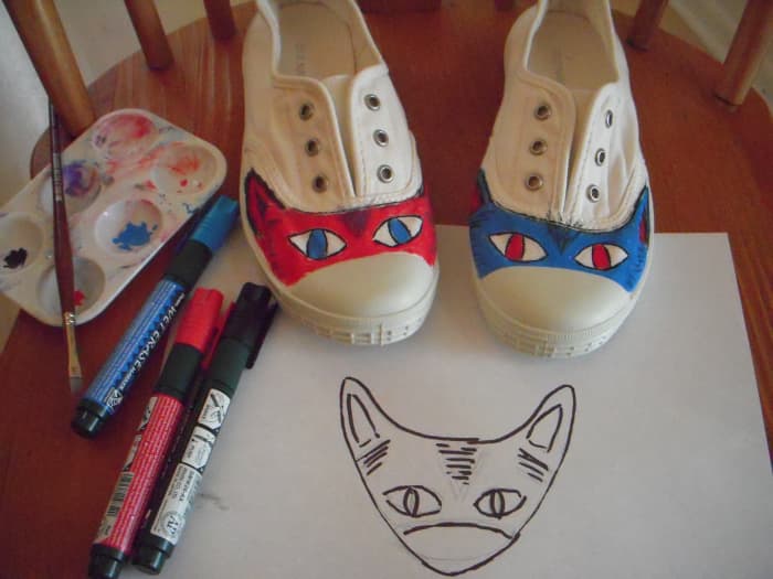 From design to finished product using chalk markers. I used an art brush to do the eyes and small lines.