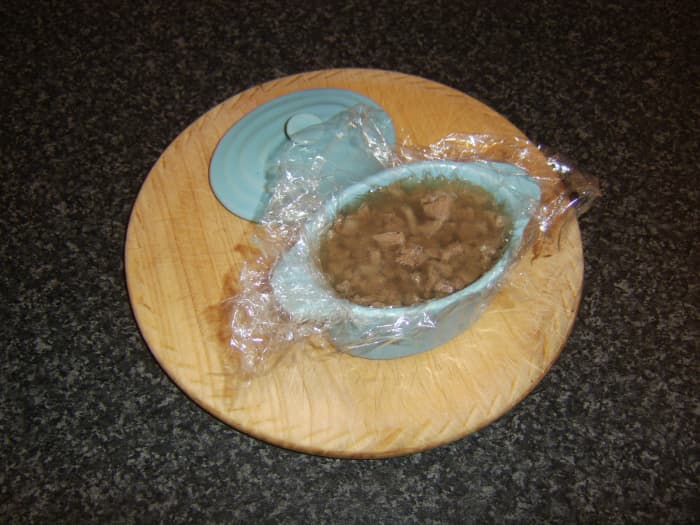 Chopped ox tongue and seasonings are added to a tureen before stock with gelatine is poured over the top