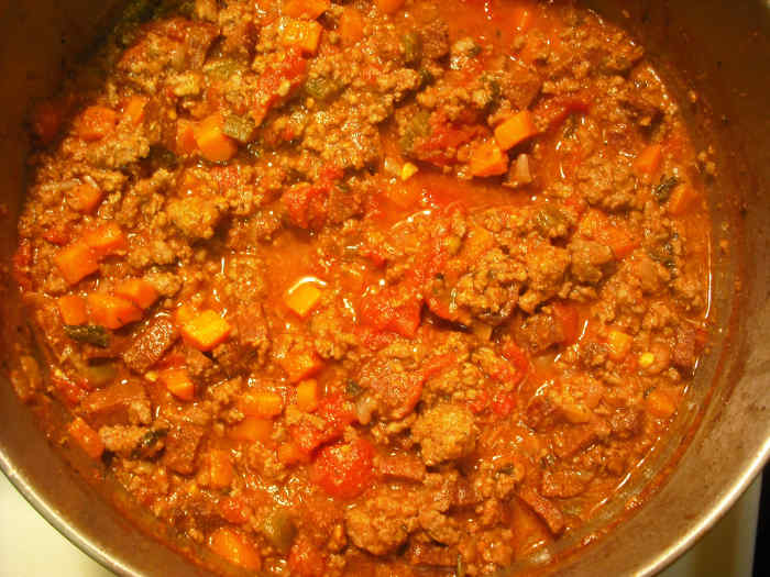 Allow to simmer for 4-8 hours, uncovered. As you can see, the sauce will have reduced quite a bit by this time.