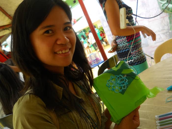 This is LJ, my only "graduate" during my first free crochet workshop. Here she is showing off her first motif while it is drying.