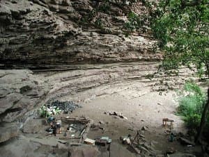 Sibudu Cave is a sandstone cliff cave in northern KwaZulu-Natal, South Africa. It is an important Middle Stone Age site.. In it evidence has been found of some of the earliest modern human technology including the earliest bone arrow, needle, and use