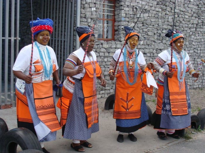 A group of wonderful Xhosa women, in the traditional dress of their culture. They sang and danced. They are highly respected elders in their society, whose duty it is to hand down stories in the oral tradition which will be lost without the likes of