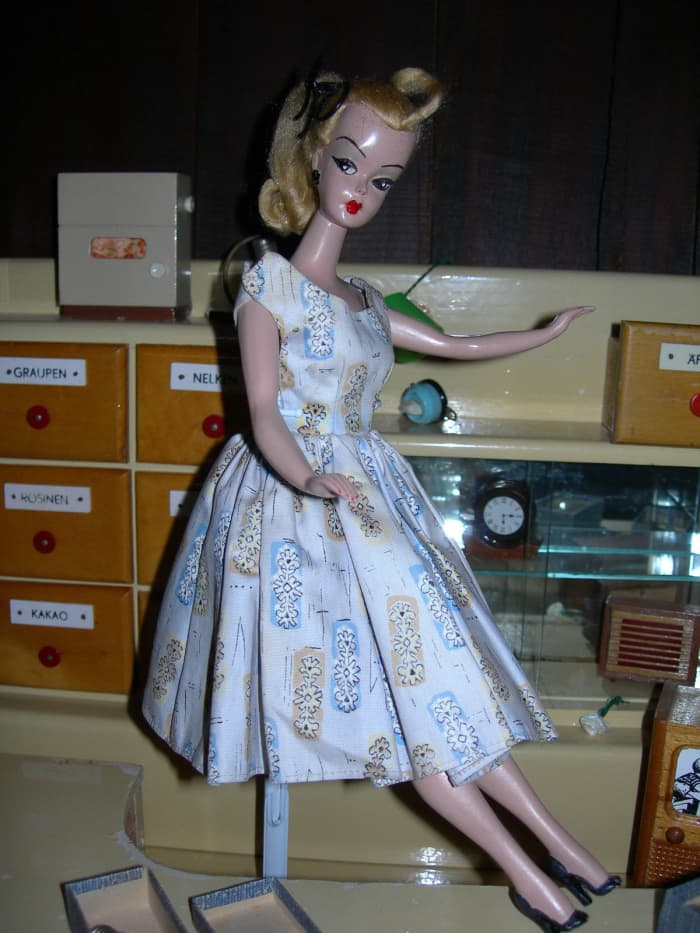 Lilli Doll The German Doll in a white print dress - the doll that Inspired Ruth Handler to create Barbie