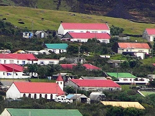 Edinburgh of the Seven Seas - the capital of Tristan da Cunha in the Atlantic Ocean. Located at roughly 37'S and 12'W, Tristan da Cunha is the world's remotest inhabited archipelago and one of the southernmost regions in the world using GMT.