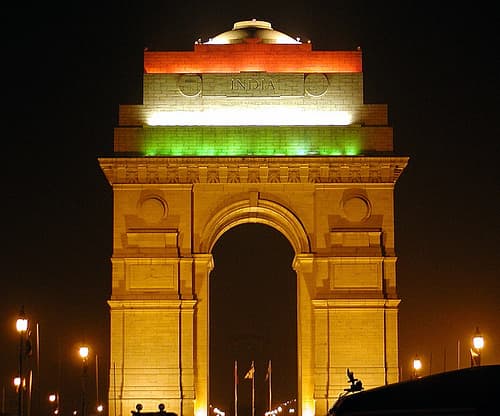The India Gate Cenotaph (decorated with the Indian flag color scheme) at New Delhi, India.