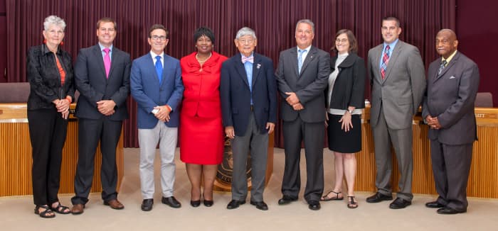 2014 City Council of Pensacola Florida smiling broadly as they are proud to have passed laws forbidding homeless people to have blankets or to cover themselves with anything as protection from the cold or weather.