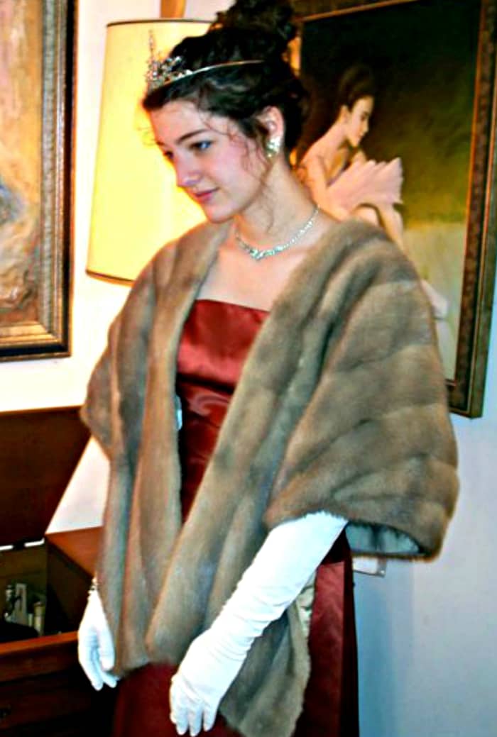 It is OK to go all out if the event is a big vintage formal ball or gala. A tasteful tiara crown and opera length gloves with help you own the floor when you walk in with you entourage.