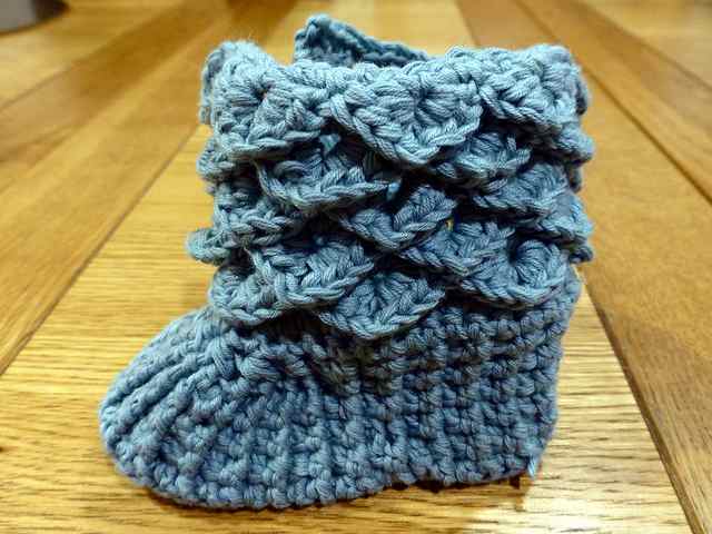 Here is a baby bootie crocheted with scales around the top and all in one color. These booties look so very clever and they are quick and easy to crochet once you get this stitch mastered.
