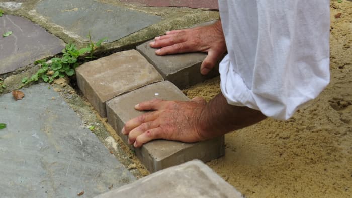 Starting the pattern at one corner with small & large sizes of concrete blocks, our project was clearly under way, after excavating & back-filling.