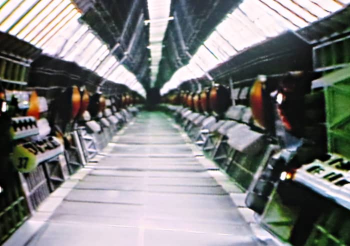 The corridor was about one and a half feet high and twelve feet-long. The corridor was divided down the middle and each side was devised into eight food and a half long sections. This set-up enabled technicians to shoot only one side of the corridor,