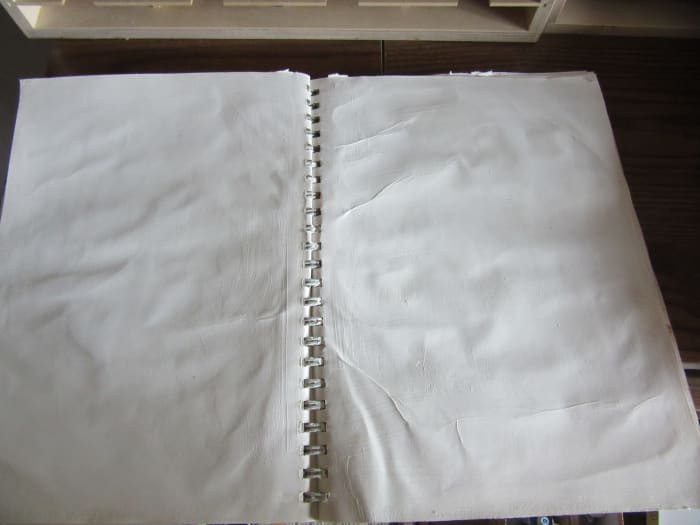 I used gesso on these pages then used Modge Podge to glue the page to the page behind it for extra strength. Wrinkles are OK. It adds a nostalgic feel. I will be adding some distress ink to make the pages look like old paper