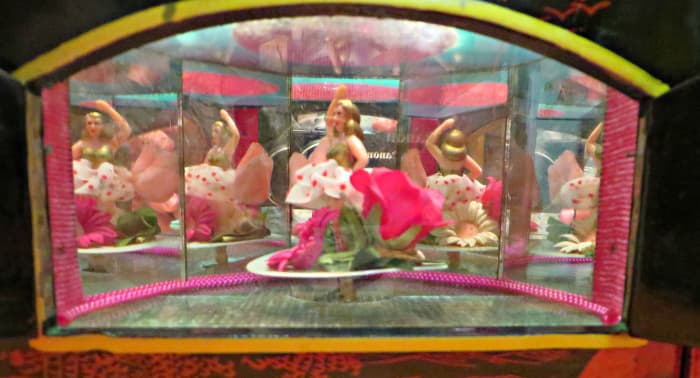 She is a lovely blonde dancing to Geisha love story, and it is like she is on a miniature stage preforming for you.